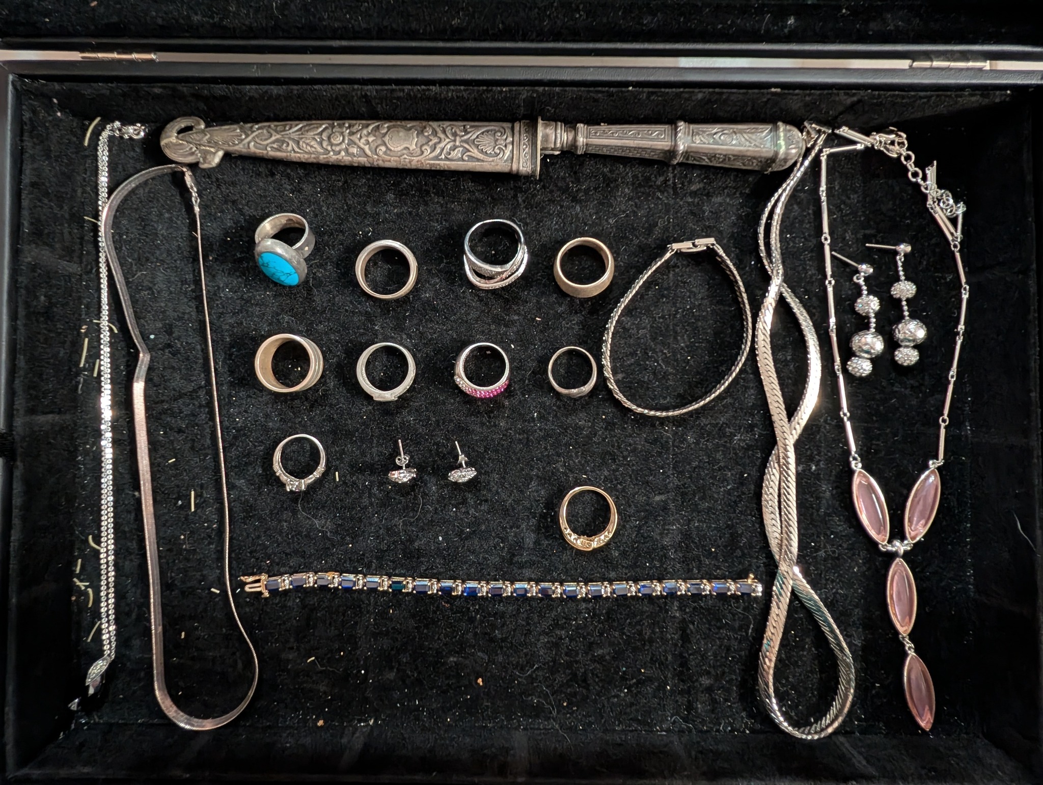 Rings, necklaces, earrings, and a decorative object